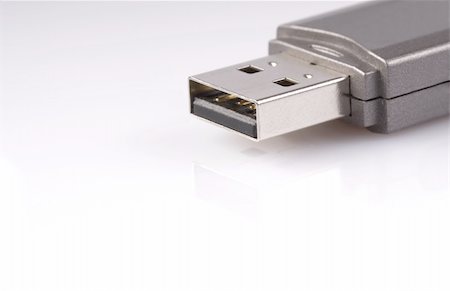simsearch:400-05259481,k - close-up of usb stick with reflection, isolated over white Stockbilder - Microstock & Abonnement, Bildnummer: 400-04946339