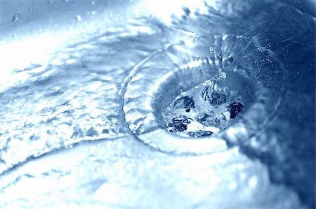 sink overflow - Water running down the drain - shallow DOF Stock Photo - Budget Royalty-Free & Subscription, Code: 400-04946639