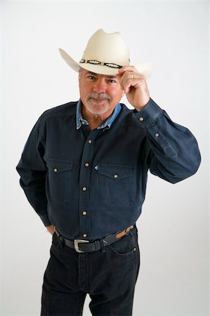 pblscooter (artist) - Howdy - cowboy tipping hat and saying hello - isolated over white Stock Photo - Budget Royalty-Free & Subscription, Code: 400-04946657