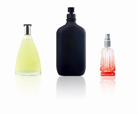 simsearch:700-06892568,k - Three bottle of perfum with reflection on white background Stock Photo - Budget Royalty-Free & Subscription, Code: 400-04947810