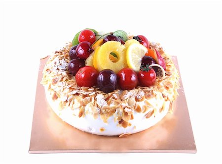 sponge puddings - Cake with fruit topping - isolated on white Stock Photo - Budget Royalty-Free & Subscription, Code: 400-04948372