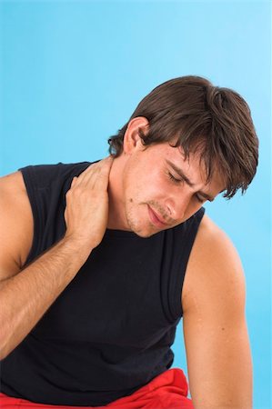 simsearch:400-04978521,k - portrait of a young man having a headache over blue background Stock Photo - Budget Royalty-Free & Subscription, Code: 400-04948547