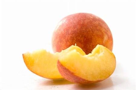 peach slice - peaches over the white background Stock Photo - Budget Royalty-Free & Subscription, Code: 400-04948869