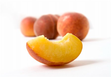 peach slice - peaches over the white background Stock Photo - Budget Royalty-Free & Subscription, Code: 400-04948872