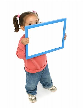 Toddler holding an empty sign over a white background Stock Photo - Budget Royalty-Free & Subscription, Code: 400-04949315