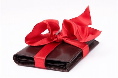 shopping male - Leather brown wallet gift with big red bow Photographie de stock - Aubaine LD & Abonnement, Code: 400-04949310