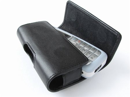 simsearch:400-03992117,k - the fragment of the mobile phone with its leather holster Stock Photo - Budget Royalty-Free & Subscription, Code: 400-04940036