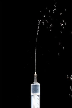simsearch:400-05320263,k - water sparks from syringe needle Photographie de stock - Aubaine LD & Abonnement, Code: 400-04940031