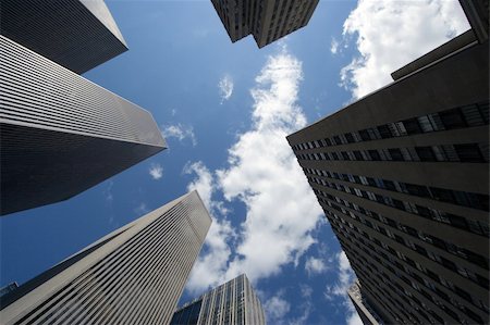 simsearch:400-04055690,k - Modern skyscrapers against a bright blue sky Foto de stock - Super Valor sin royalties y Suscripción, Código: 400-04940597