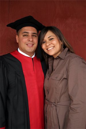 people successful college graduate with family - Graduation day for attractive young man and his beautiful girlfriend. Stock Photo - Budget Royalty-Free & Subscription, Code: 400-04941075