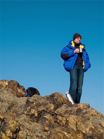 simsearch:400-08506088,k - man thinking on the mountain top with blue sky Fotografie stock - Microstock e Abbonamento, Codice: 400-04941154