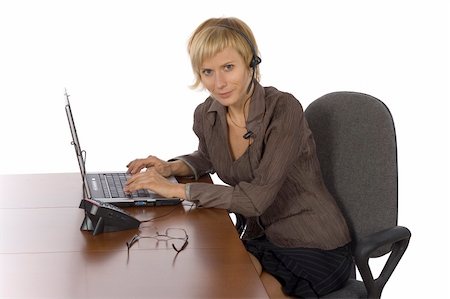 simsearch:400-08554629,k - isolated woman at the desk wearing headset Fotografie stock - Microstock e Abbonamento, Codice: 400-04941173