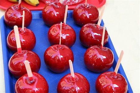 red stick candy - Red Candy Covered Apples Stock Photo - Budget Royalty-Free & Subscription, Code: 400-04941244