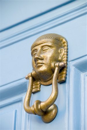 A brass door knocker in the style of an Egyptian Pharaoh Stock Photo - Budget Royalty-Free & Subscription, Code: 400-04941488