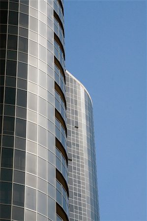 simsearch:400-05224708,k - Modern skyscrapers against a bright blue sky Photographie de stock - Aubaine LD & Abonnement, Code: 400-04941512