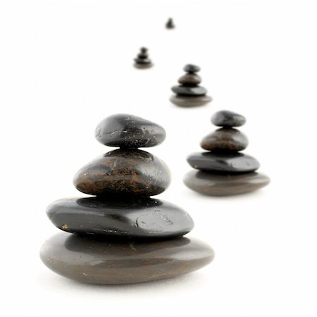 simsearch:400-04946108,k - Stacks of balanced stones with shadow on white background. Very shallow DOF Photographie de stock - Aubaine LD & Abonnement, Code: 400-04941800