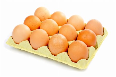 A dozen eggs in a carton container over a white background Stock Photo - Budget Royalty-Free & Subscription, Code: 400-04941802