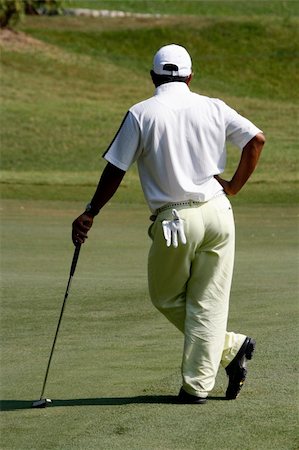 racnus (artist) - A golfer playing golf in the field. Fotografie stock - Microstock e Abbonamento, Codice: 400-04942259