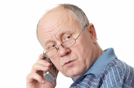 simsearch:400-04435288,k - Bald senior man talking on the phone. Isolated on white. Photographie de stock - Aubaine LD & Abonnement, Code: 400-04942524