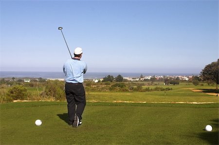 simsearch:400-05370464,k - Golfer playing golf on the tee box. Copy space. Stock Photo - Budget Royalty-Free & Subscription, Code: 400-04942643