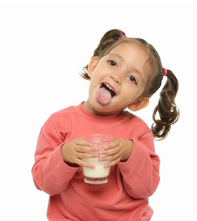 sticking out her tongue - Toddler enjoying a glass of fresh milk Foto de stock - Super Valor sin royalties y Suscripción, Código: 400-04942771