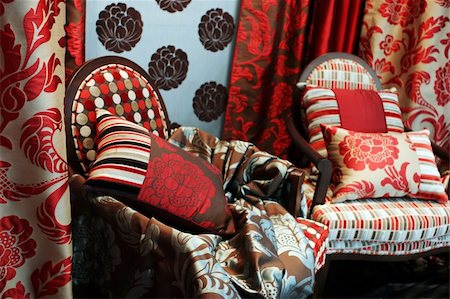 Luxurious red arm chairs with satin pillows - home interiors Foto de stock - Super Valor sin royalties y Suscripción, Código: 400-04942787