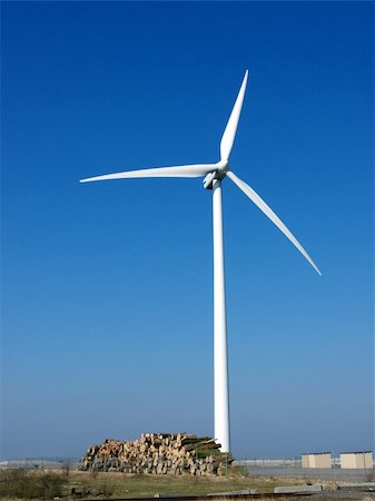 portrait of wind turbine in blue sky Fotografie stock - Microstock e Abbonamento, Codice: 400-04942941