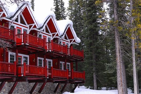 snow cosy - Log building of a mountain lodge in winter at ski resort with pine trees Stock Photo - Budget Royalty-Free & Subscription, Code: 400-04943012