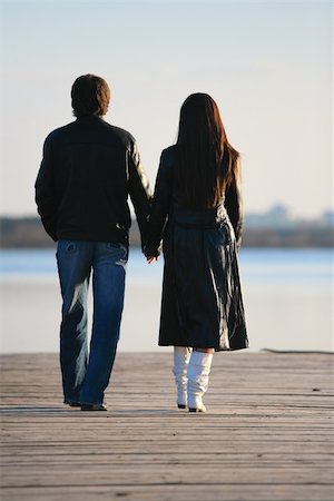 The in love pair walks on the bridge Stock Photo - Budget Royalty-Free & Subscription, Code: 400-04943485