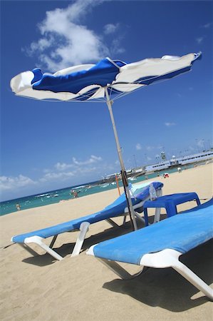 Beach parasol on sunny but windy day Stock Photo - Budget Royalty-Free & Subscription, Code: 400-04943498