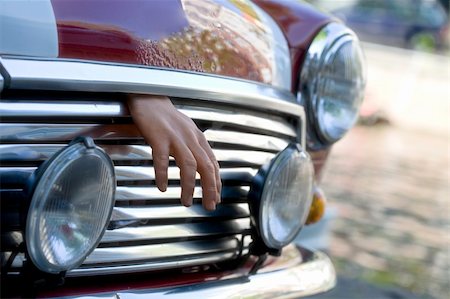 dead hand coming out of the bonnet Stock Photo - Budget Royalty-Free & Subscription, Code: 400-04943764