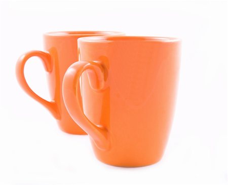 simsearch:400-03971684,k - Coffee mugs in orange on white Foto de stock - Super Valor sin royalties y Suscripción, Código: 400-04954071