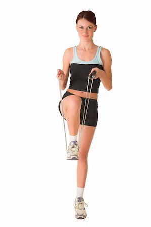 people exercising images skipping - Woman in gym wear standing on one leg holding foot with skipping rope. Stock Photo - Budget Royalty-Free & Subscription, Code: 400-04955030