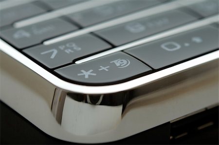 simsearch:400-03992117,k - A close up shot of mobile keypad under light Stock Photo - Budget Royalty-Free & Subscription, Code: 400-04955394