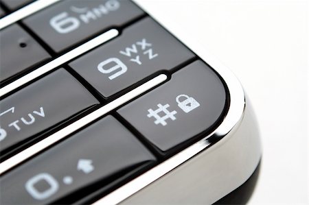 simsearch:400-03992117,k - A close up shot of mobile keypad under light Stock Photo - Budget Royalty-Free & Subscription, Code: 400-04955395