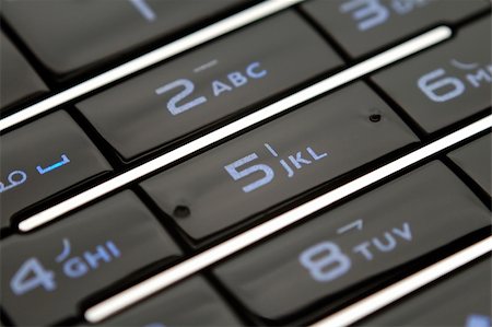 simsearch:400-03992117,k - A close up shot of mobile keypad under light Stock Photo - Budget Royalty-Free & Subscription, Code: 400-04955396