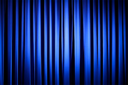 simsearch:400-04452784,k - Spotlight on  A Blue Theater Curtain Before Show Begins Stock Photo - Budget Royalty-Free & Subscription, Code: 400-04955598