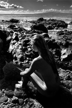 simsearch:400-04450908,k - Rear view of Filipino young nude woman sitting on rocky beach. Stock Photo - Budget Royalty-Free & Subscription, Code: 400-04955641