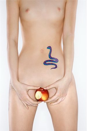 Portrait of nude attractive redhead Caucasian young woman with snake tattoo holding apple. Stock Photo - Budget Royalty-Free & Subscription, Code: 400-04955767