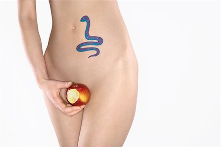 Portrait of nude attractive redhead Caucasian young woman with snake tattoo holding apple. Stock Photo - Budget Royalty-Free & Subscription, Code: 400-04955768