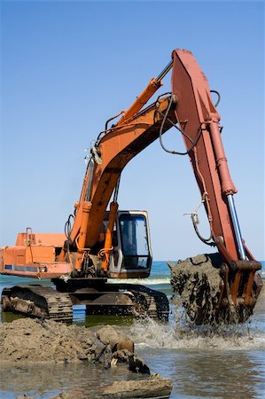 simsearch:400-05111345,k - Orange Excavator on the beach Fotografie stock - Microstock e Abbonamento, Codice: 400-04955835