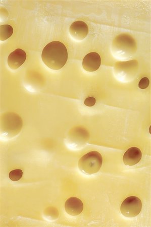 emmentaler cheese - Background image of a large block of Swiss cheese (Emmentaler). Stock Photo - Budget Royalty-Free & Subscription, Code: 400-04956094