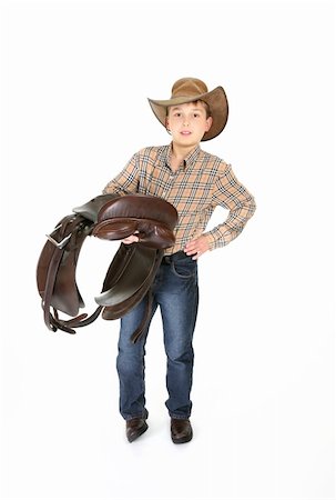 Young boy getting ready for some horse riding. Photographie de stock - Aubaine LD & Abonnement, Code: 400-04956141