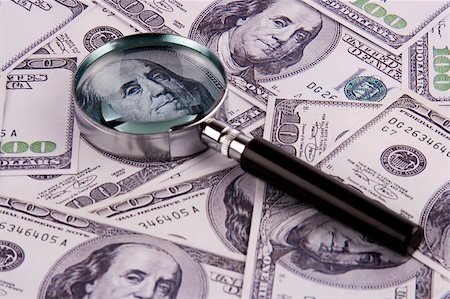 simsearch:400-04894431,k - A magnifying glass over some hundred dollar bills. Stock Photo - Budget Royalty-Free & Subscription, Code: 400-04956161