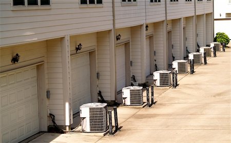 Row of town houses with air conditioning units outside Stock Photo - Budget Royalty-Free & Subscription, Code: 400-04956727