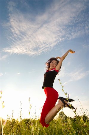 simsearch:400-04450996,k - happy young beautiful girl jumping in the field Stock Photo - Budget Royalty-Free & Subscription, Code: 400-04956755