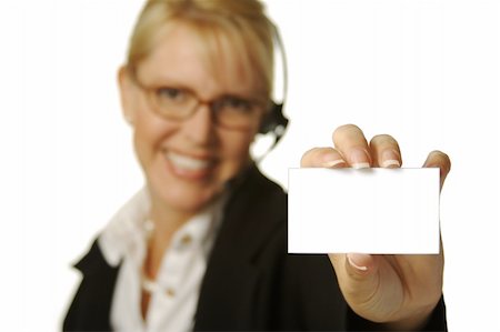 simsearch:400-04233879,k - A beautiful friendly secretary/telephone operator holding a blank card ready for your message Photographie de stock - Aubaine LD & Abonnement, Code: 400-04956783