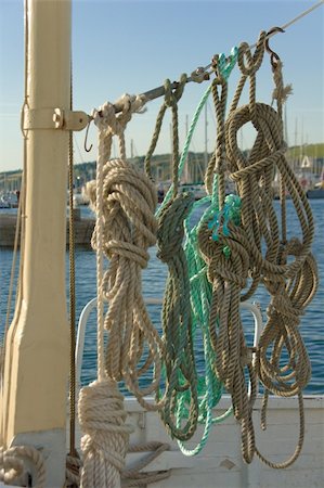 rope deck knot - Ropes in a nice tidy order hung up to dry on deck of a fishing boat Stock Photo - Budget Royalty-Free & Subscription, Code: 400-04956921