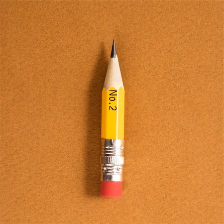 simsearch:400-05289294,k - Short number two pencil on tan background. Fotografie stock - Microstock e Abbonamento, Codice: 400-04956974