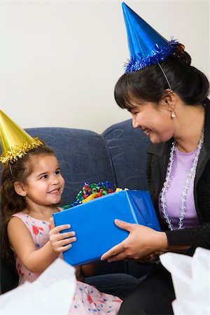 simsearch:400-04452450,k - Mother giving daughter present at birthday party. Stock Photo - Budget Royalty-Free & Subscription, Code: 400-04957402